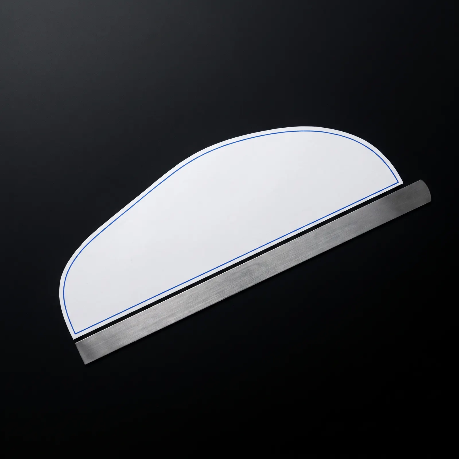 A flat base pattern with a steel ruler along its edge.