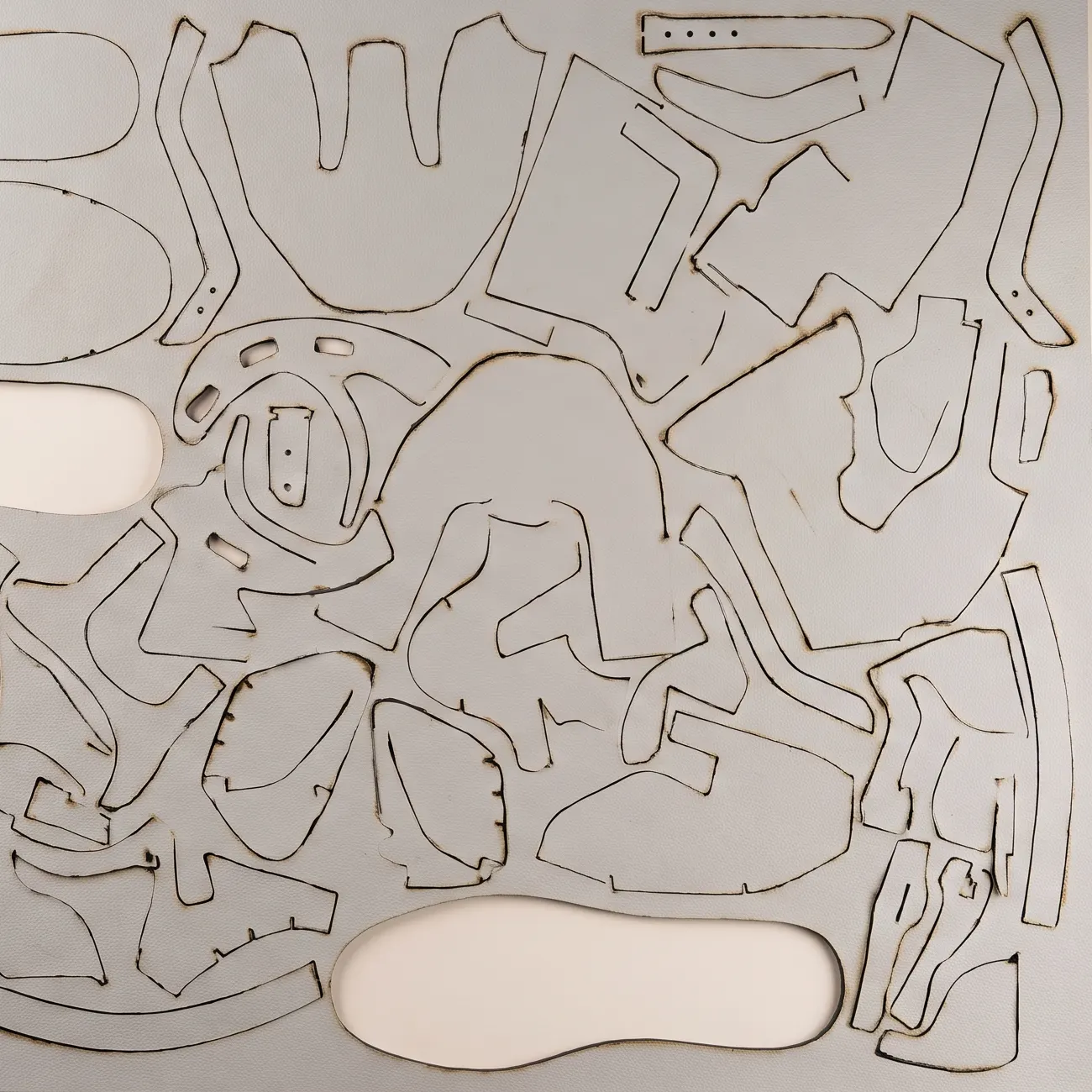 A material sheet densely filled with nested pattern shapes.